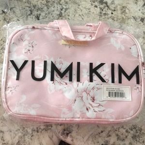 Yumi Kim hanging train case